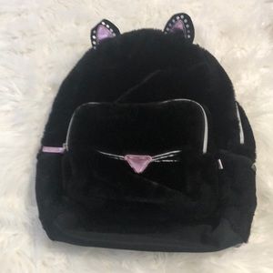 Black and pink cat backpack.